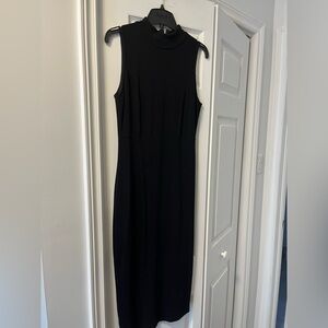 Black stretch pencil dress, high collar with zipper on back seam.